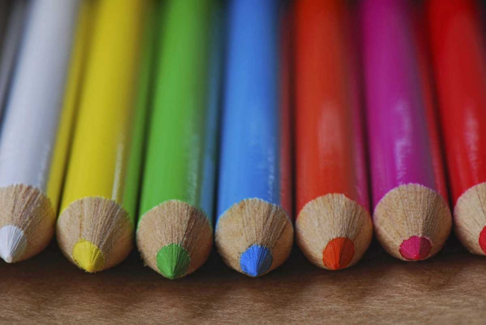 Row of multicolored colored pencils lay on table art print by Steve Terrill for $57.95 CAD