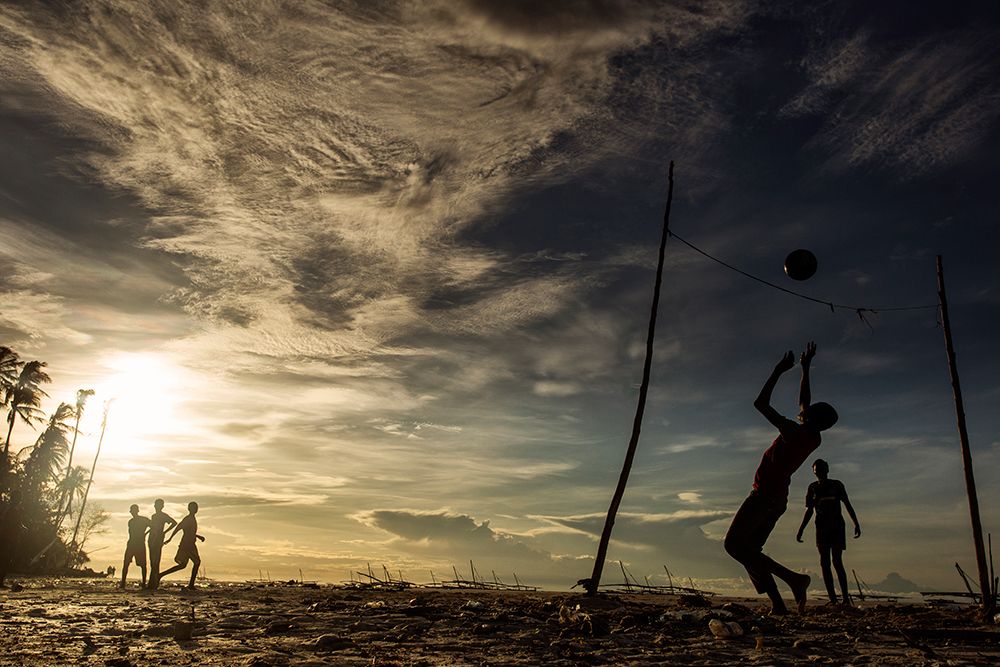 Children playing football in Zanzibar. art print by Dan Mirica for $57.95 CAD