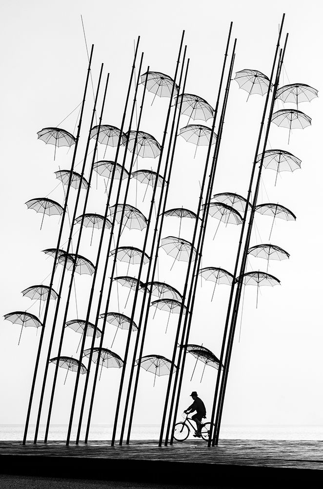 Under The Umbrellas art print by George Digalakis for $57.95 CAD