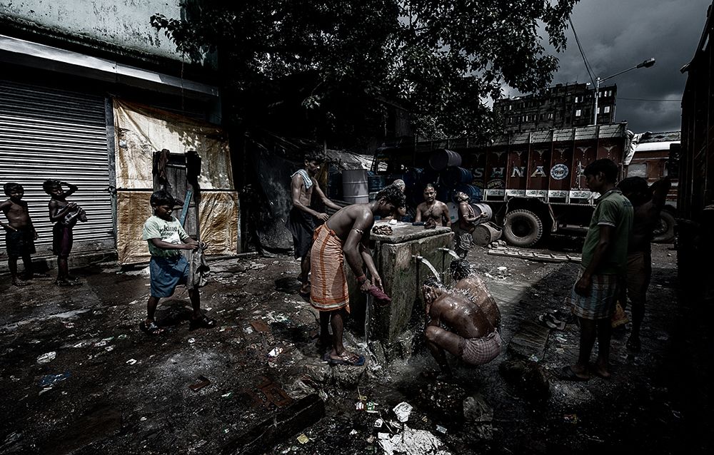 Having a shower in the street - Colcatta - India art print by Joxe Inazio Kuesta for $57.95 CAD