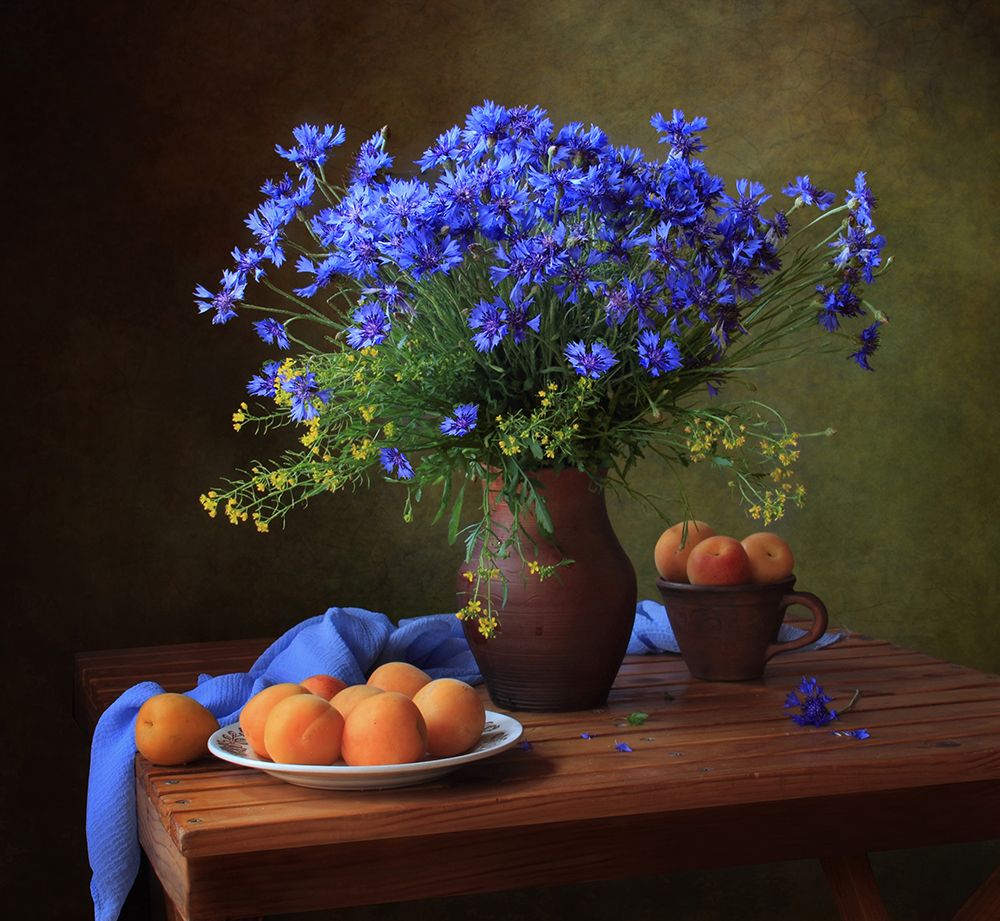 Still life with a bouquet of cornflowers and apricots art print by Tatyana Skorokhod for $57.95 CAD