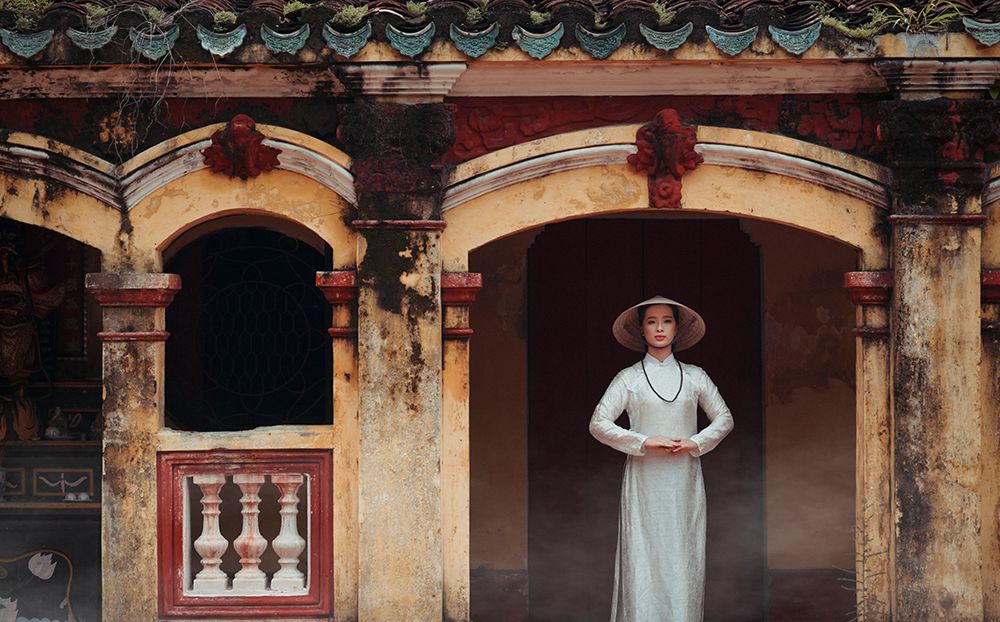 A Vietnamese girl in a traditional ao dai dress is praying for happiness art print by Vu Thien Vu for $57.95 CAD