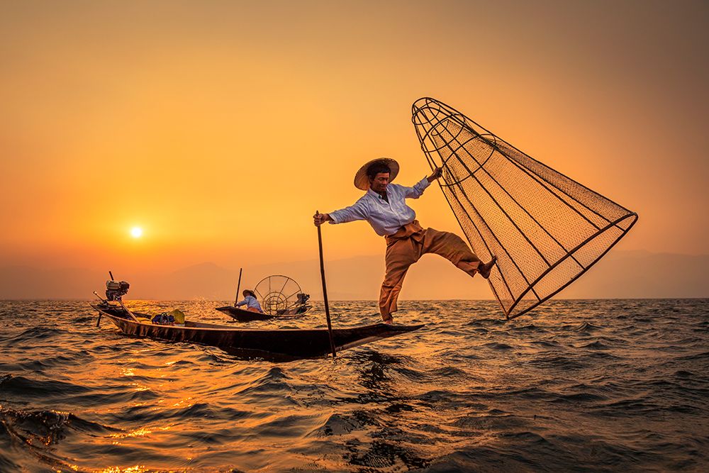 The traditional Fishermen of Inle Lake art print by Mahendra Bakle for $57.95 CAD