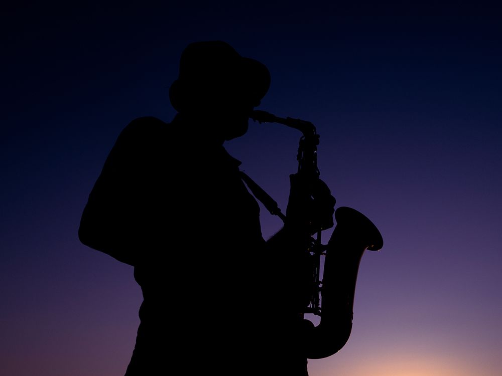 A Musician Playing The Saxophone At Sunset art print by Engin Akyurt for $57.95 CAD