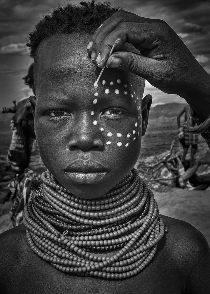 Painting the face of a karo tribe girl (Omo Valley-Ethiopia) art print by Joxe Inazio Kuesta for $57.95 CAD