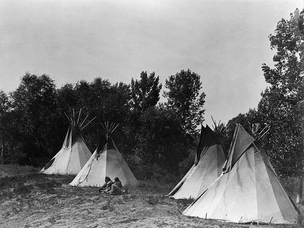 An Assiniboin camp containing four tepees with Indians seated on ground art print by Edward Curtis for $57.95 CAD