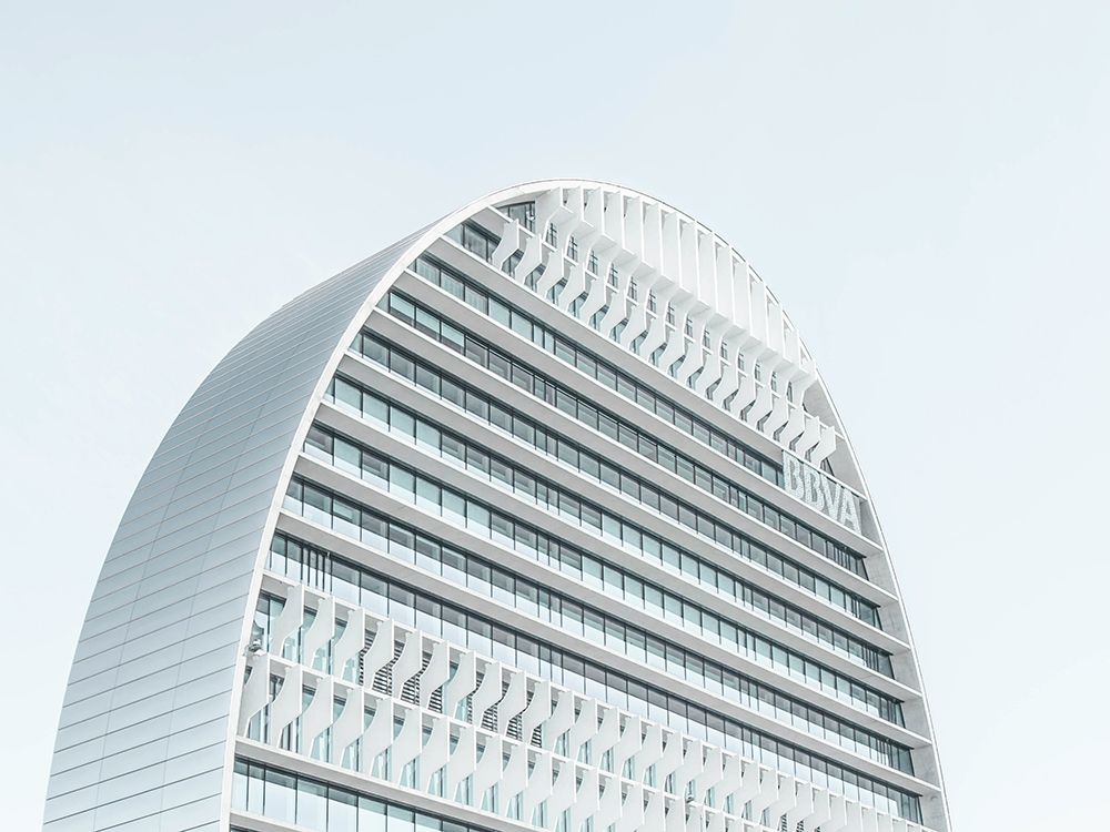 A modern skyscraper with a rounded roof in Madrid art print by Artographie for $57.95 CAD