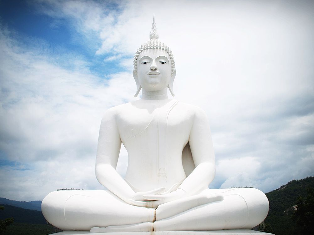 White Buddha Statue with Clouds art print by Artographie for $57.95 CAD