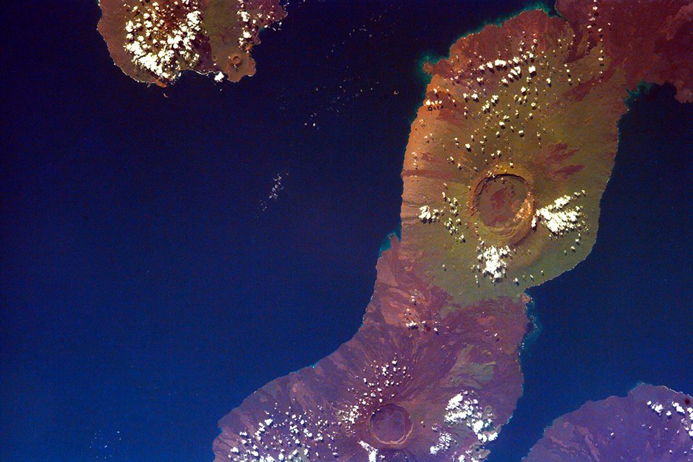 The Galapagos Islands showing two large shield volcanoes on Isla Isabella art print by NASA for $57.95 CAD