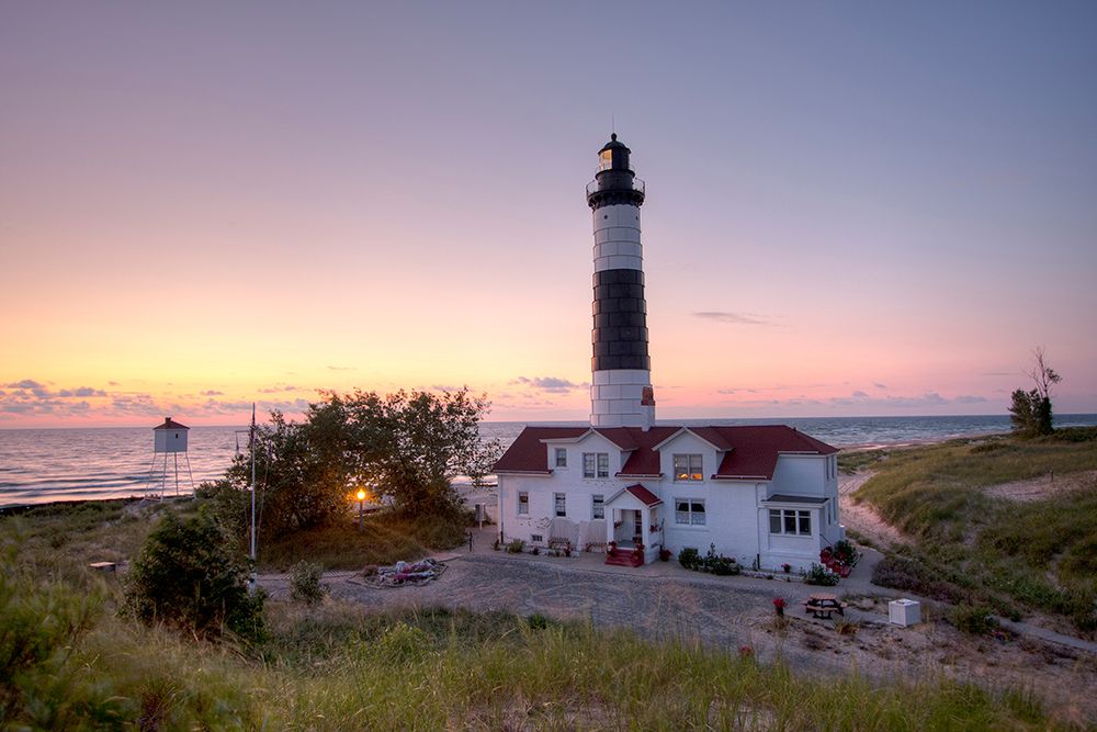 Big Sable Point Lighthouse At Sunset art print by Adam Romanowicz for $57.95 CAD