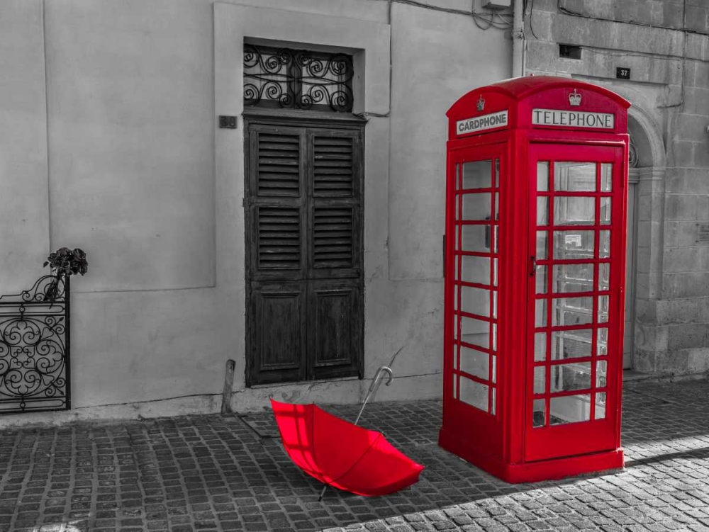 Red umbrella and Telephone box on street of Marsaxlokk, Malta art print by Assaf Frank for $57.95 CAD