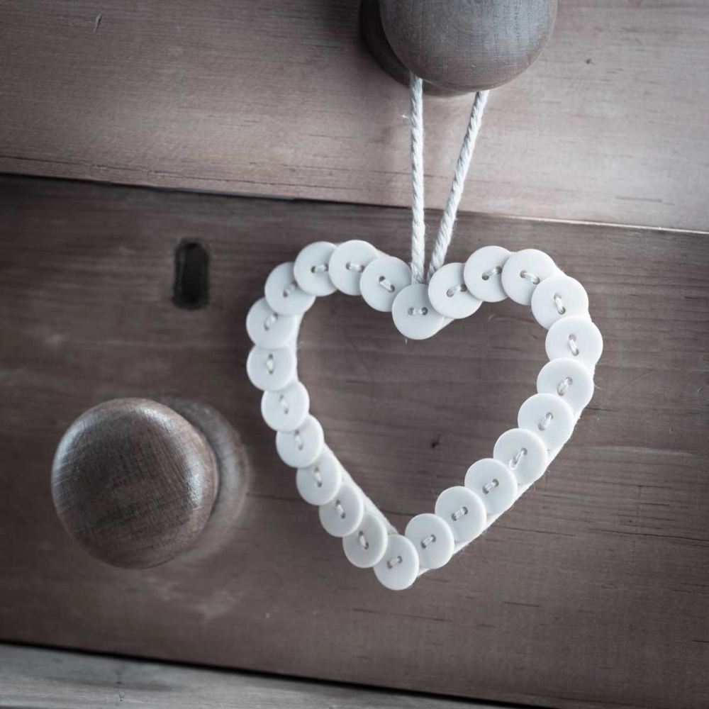 heart made of buttons hunging on a handle art print by Assaf Frank for $57.95 CAD