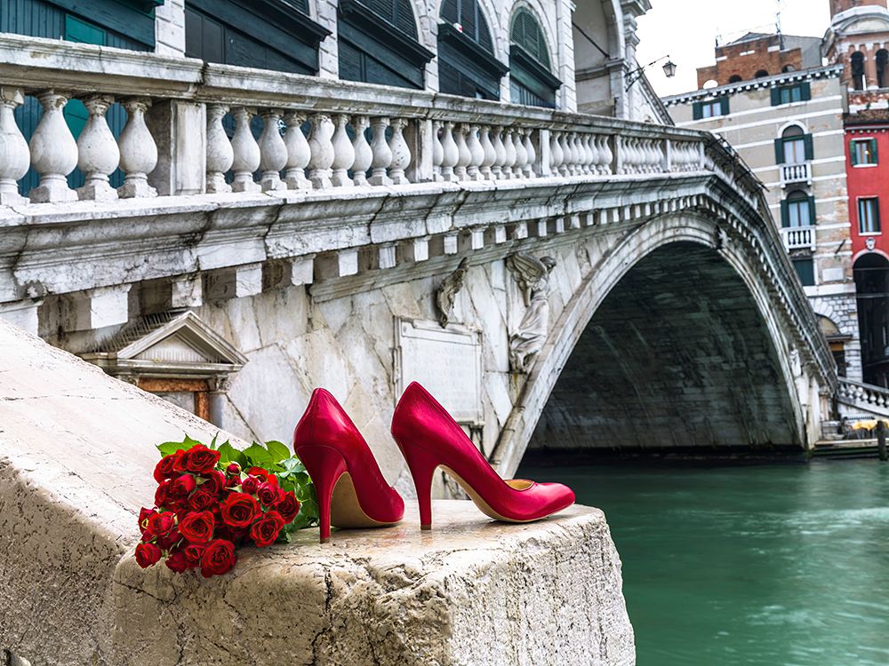 Bunch of red roses and red high heel shoes, Rialto Bridge, Venice, Italy art print by Assaf Frank for $57.95 CAD