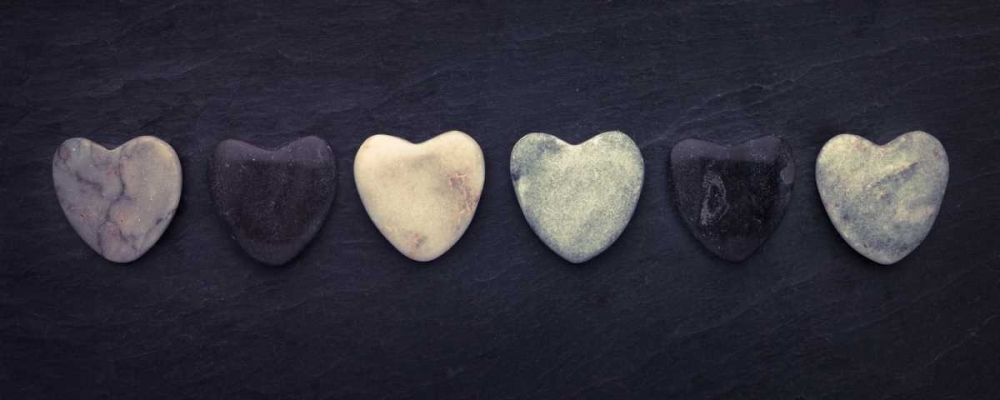 Heart shaped stones in a row art print by Assaf Frank for $57.95 CAD