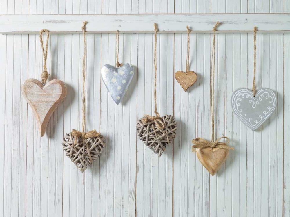 Hearts hanging on wooden background art print by Assaf Frank for $57.95 CAD