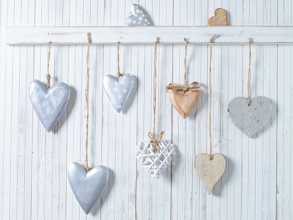 Hearts hanging on wooden background art print by Assaf Frank for $57.95 CAD