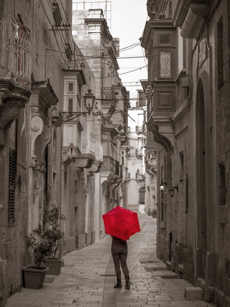 Tourist with umbrella at narrow street on Birgu, Malta art print by Assaf Frank for $57.95 CAD