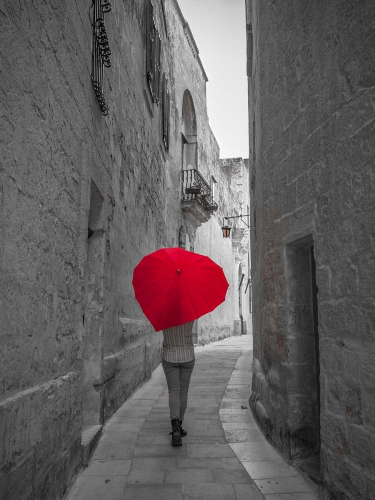 Tourist with heart shaped umbrella walking through narrow street of Mdina, Malta art print by Assaf Frank for $57.95 CAD