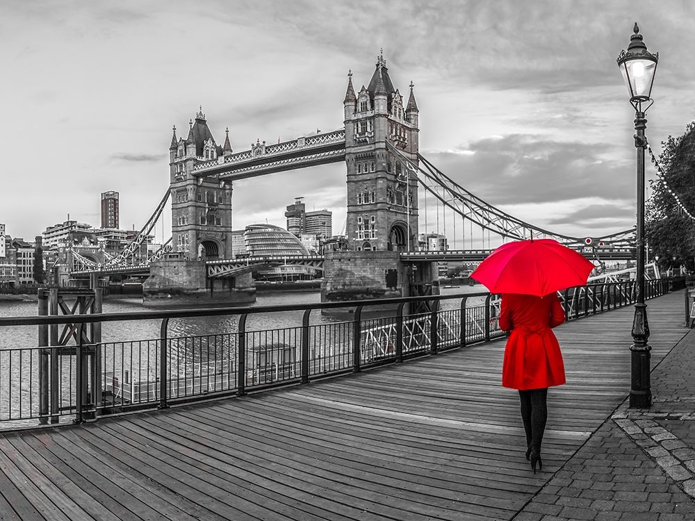 Tourist with red umbrella on promenade near Tower bridge, London, UK art print by Assaf Frank for $57.95 CAD