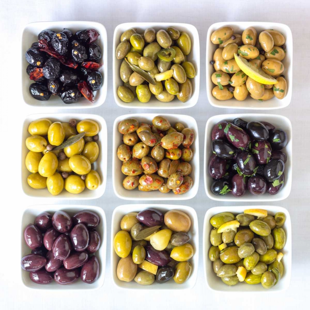 Varieties of Olives in bowls on white background art print by Assaf Frank for $57.95 CAD