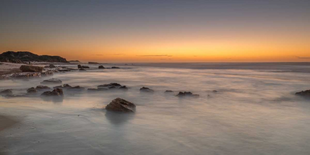 Sunset on rocky beach with colorful sky art print by Assaf Frank for $57.95 CAD