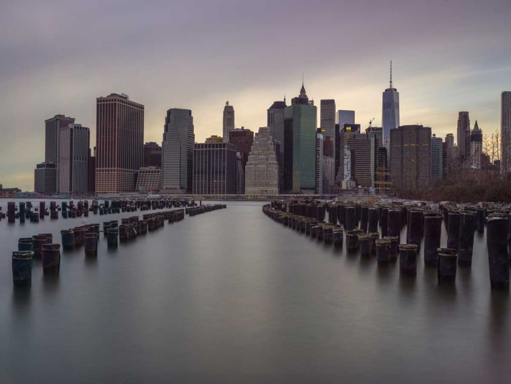 Manhattan skyline with rows of groynes in East river, New York art print by Assaf Frank for $57.95 CAD