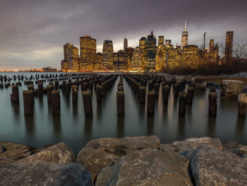 Manhattan skyline with rows of groynes in East river, New York art print by Assaf Frank for $57.95 CAD