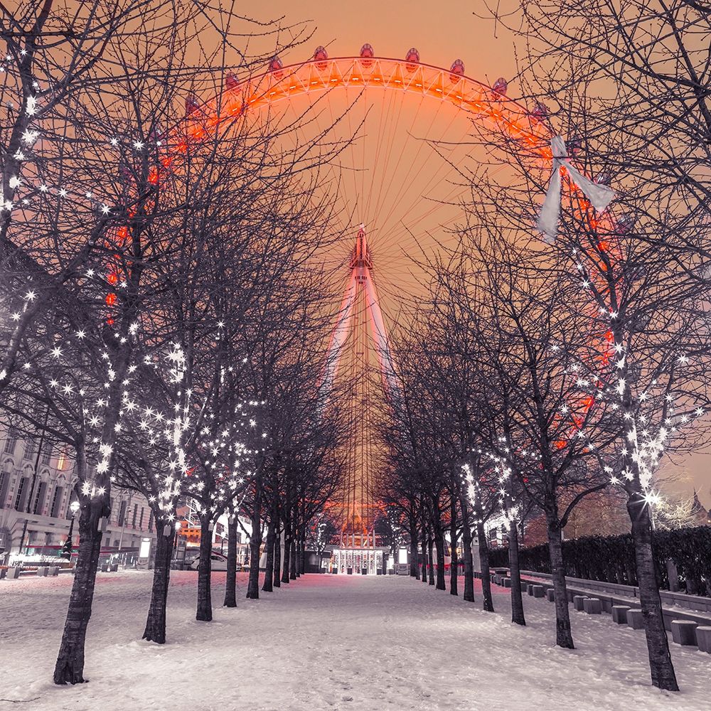 London Eye at night with trees in the foreground lit with lights and snow on the pathway-London-UK art print by Assaf Frank for $57.95 CAD
