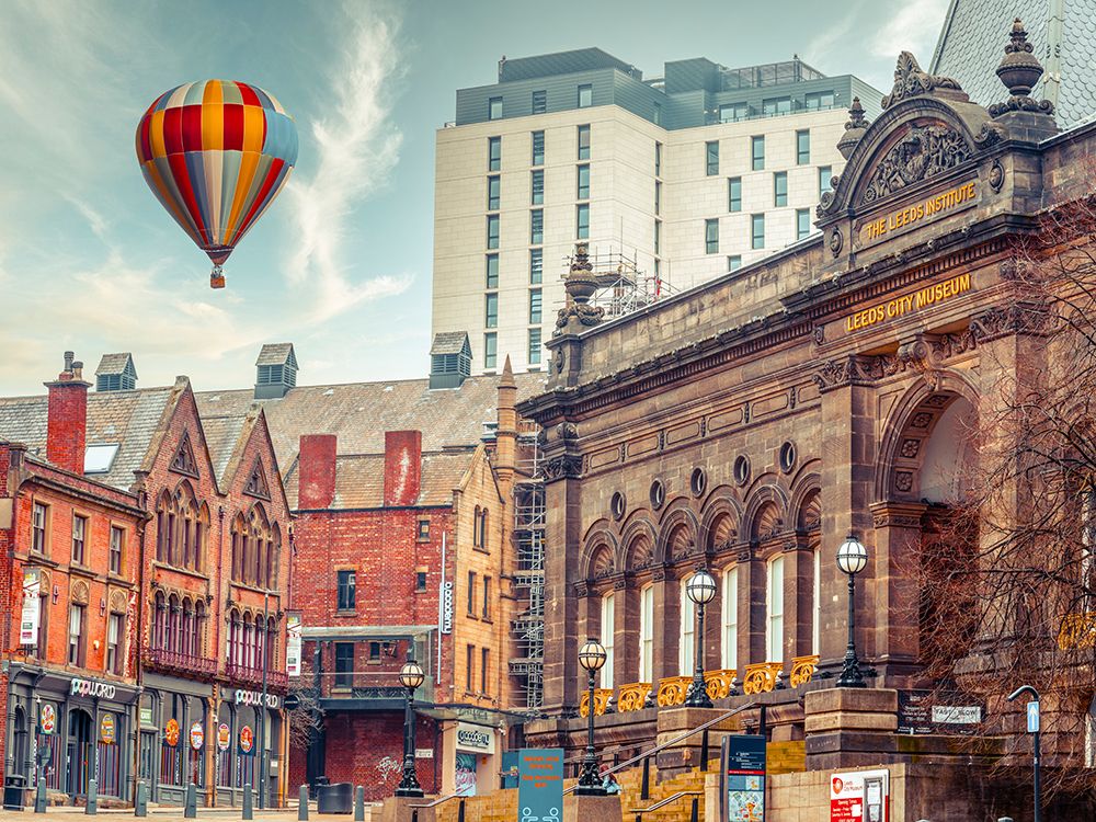 Hot air balloon over Leeds cityscape art print by Assaf Frank for $57.95 CAD