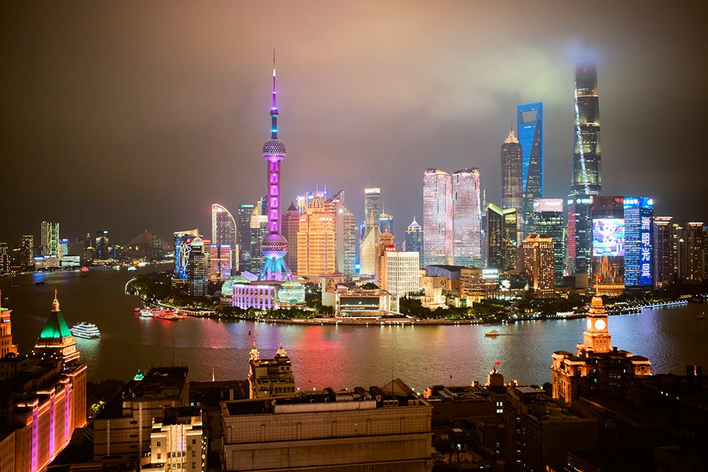 Shanghai Skyline Illuminated At Night With Colorful Lights And A Cloudy Sky. Shanghai, China art print by LB Studios for $57.95 CAD