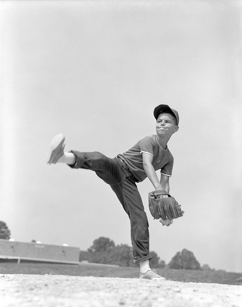 1960S Boy Wearing Baseball Cap Tee Shirt Blue Jeans And Determined Expression In Wind-Up To Pitch art print by ClassicStock for $57.95 CAD