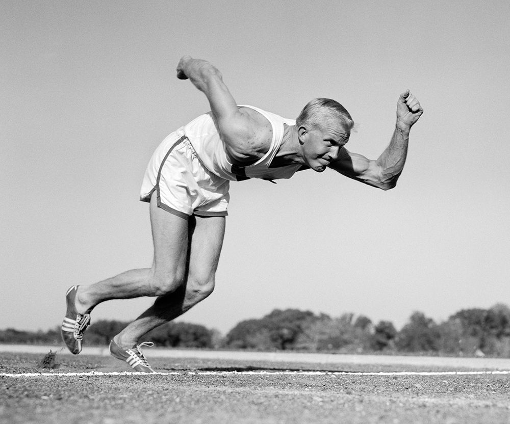 1960S Runner Coming Out Of Starting Position art print by ClassicStock for $57.95 CAD