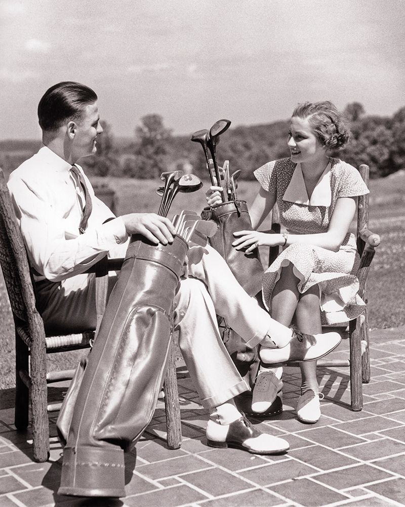 1930S Couple Man And Woman Sitting On Patio Each With Golf Bag And Clubs Talking About Game Clothes art print by H. Armstrong Roberts for $57.95 CAD