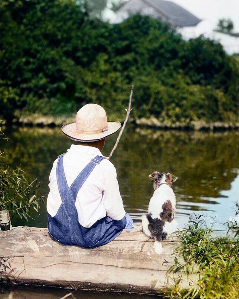 1920S 1930S Farm Boy Wearing Straw Hat And Overalls Sitting On Log With Spotted Dog Fishing In Pond art print by H. Armstrong Roberts for $57.95 CAD