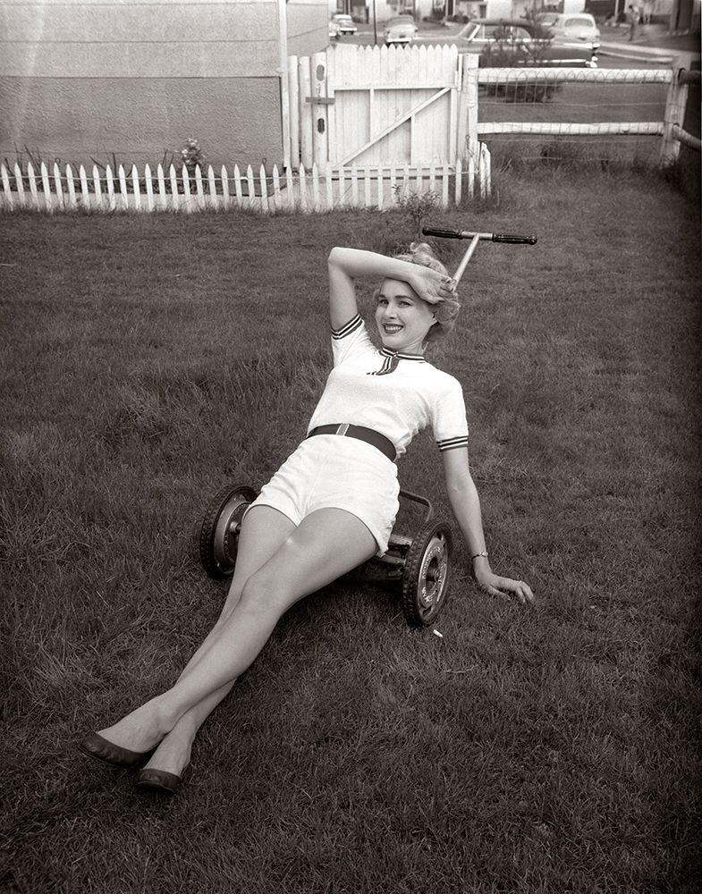 1950S Exhausted Woman Wearing White Short Shorts Lying On Top Of A Push Lawn Mower Looking At Camera art print by ClassicStock for $57.95 CAD