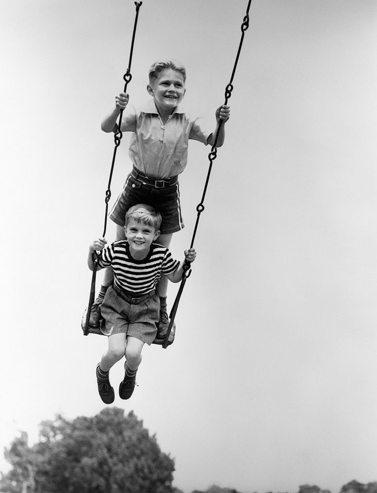 1930S Two Smiling Boys Sitting Standing On Playground Swing art print by ClassicStock for $57.95 CAD