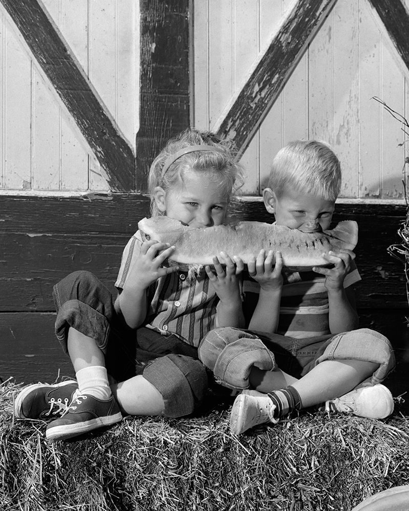 1960S Boy Girl Sitting On Bale Of Hay Sharing Eating Slice Of Watermelon Summer Fruit art print by ClassicStock for $57.95 CAD