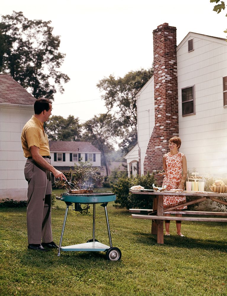 1960S Couple Suburban Backyard Man Grilling Woman Setting Picnic Table art print by ClassicStock for $57.95 CAD