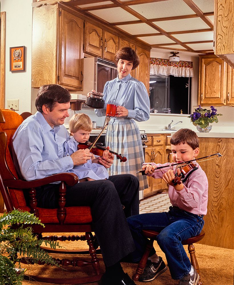 Vintage Photograph. Family Bonding Over Music And Coffee In A Cozy Kitchen Setting. art print by ClassicStock for $57.95 CAD