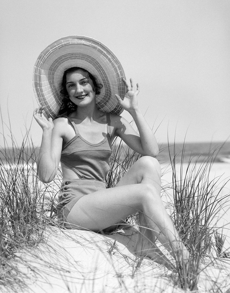1920S 1930 Smiling Bathing Beauty Wearing Straw Hat Sitting On Beach Sand Dune Looking At Camera art print by ClassicStock for $57.95 CAD