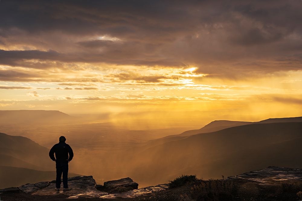 Hiker At Sunset Over Tankwa Karoo Basin. Northern Cape, South Africa art print by Roger de la Harpe for $57.95 CAD