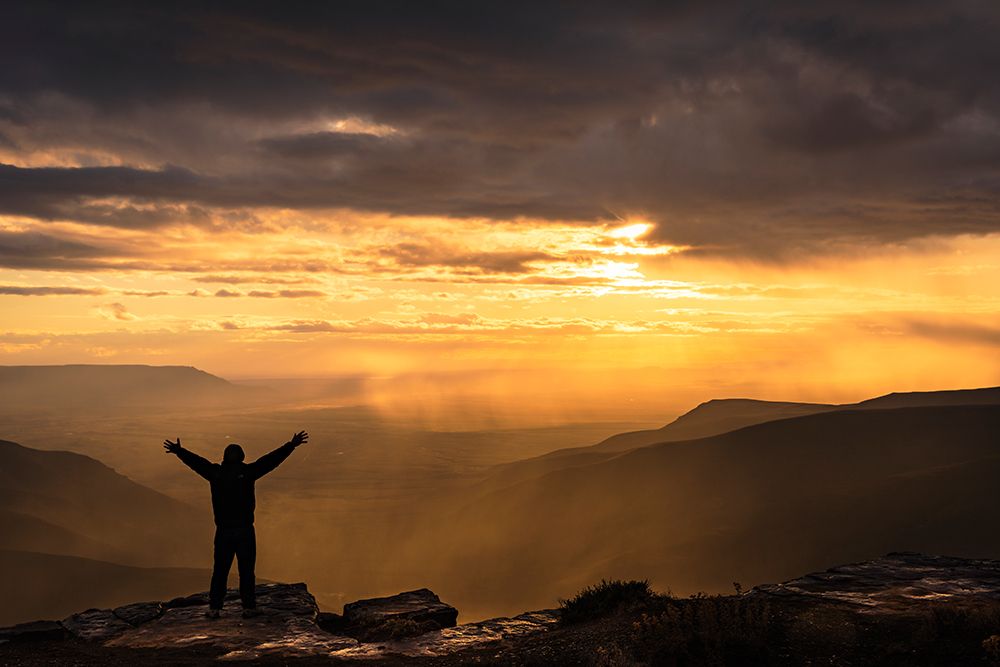 Hiker At Sunset Over Tankwa Karoo Basin. Northern Cape, South Africa art print by Roger de la Harpe for $57.95 CAD