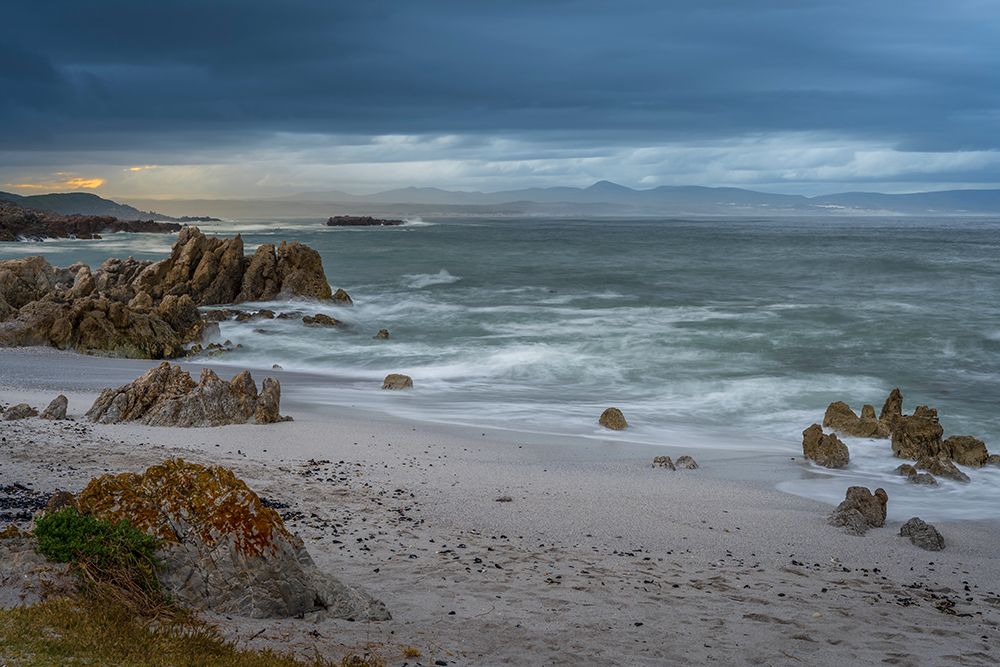 View Across Walker Bay From Skulpiesbaai On A Cold, Cloudy Morning art print by Roger de la Harpe for $57.95 CAD