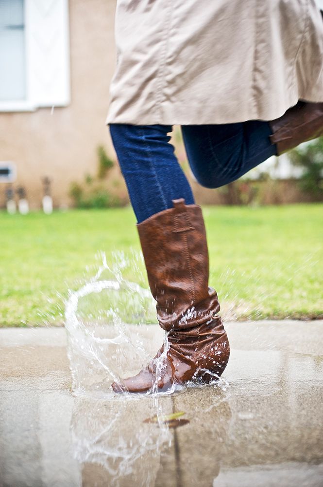 A Foot Splashes Into A Puddle While Running Along A Sidewalk During A Rainstorm. art print by David Zentz for $57.95 CAD