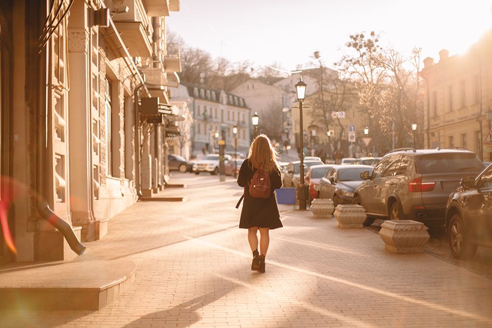 Rear View Of Teenage Girl With Backpack Walking On City Street art print by Dmytro Betsenko for $57.95 CAD