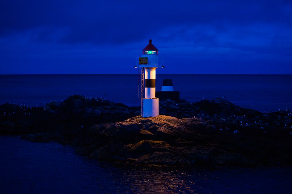 Small Lighthouse On Rock At Entrance To Harbor In Sorland On Vaeroy Island, Lofoten Islands, Norway. art print by Ethan Welty for $57.95 CAD