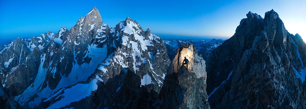 A Climber Stands Between Grand Teton And Teewinot Mountain In Grand Teton National Park, Wyoming. art print by Ethan Welty for $57.95 CAD