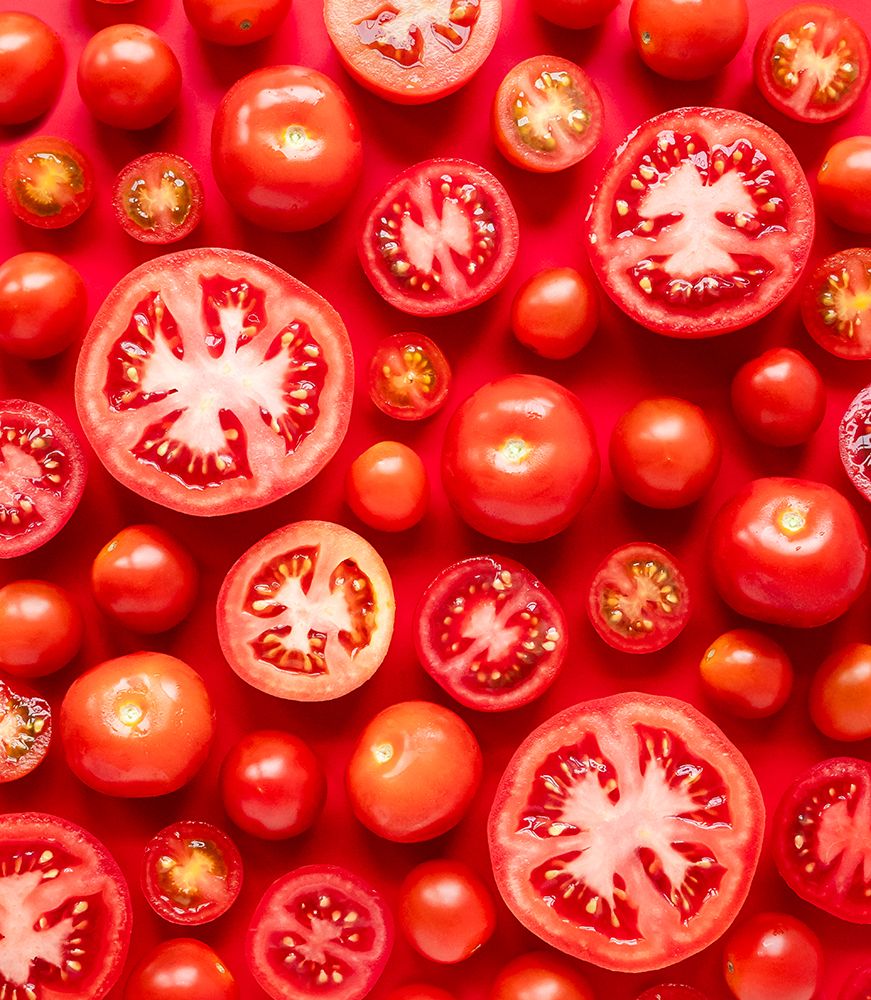 Top View Of Many Whole And Cut Tomatoes On Red Background. art print by Dorene Hookey for $57.95 CAD