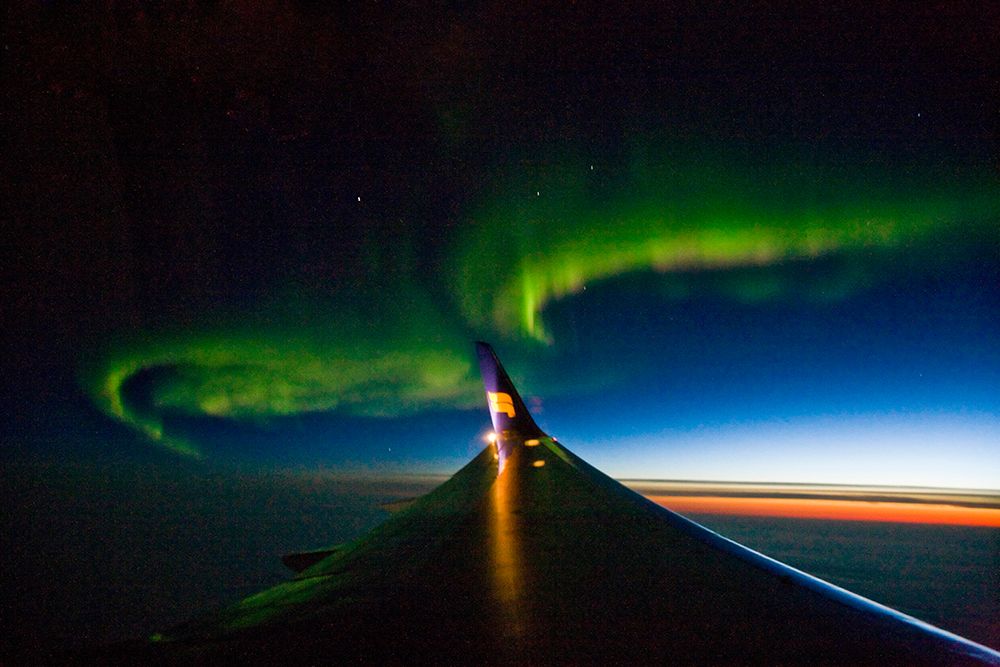 View Of The Northern Lights As Seen From An Airplane Flight Over The North Atlantic Ocean. art print by Henry Georgi for $57.95 CAD