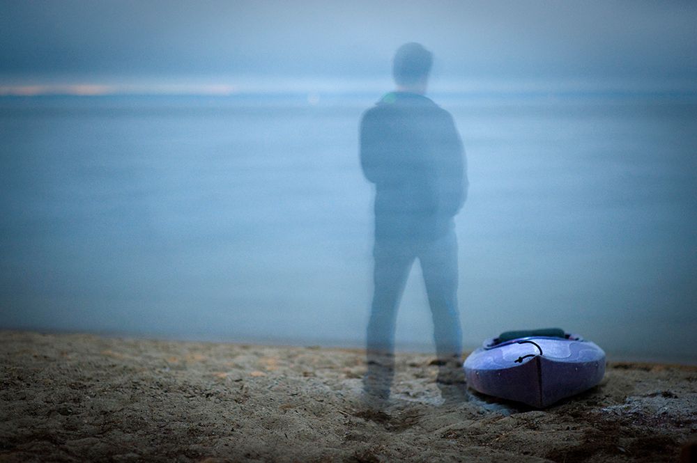 A Lone Kayak With Shadow Figure On A Deserted Beach Lit By Moonlight. art print by Kevin Steele for $57.95 CAD